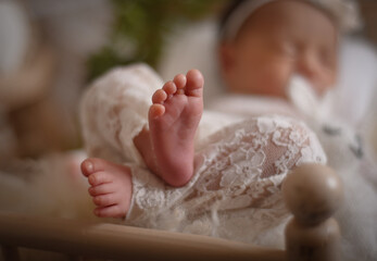 Cute adorable little small newborn baby girl posing smiling sleeping
