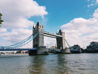 Fototapeta na wymiar Gorgeous View Of Tower Bridge In The Heart Of London, By The River, Under The Fluffy Sky