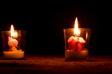 Burn a candle in a snow house-shaped glass at Christmas.