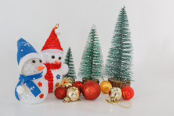 Christmas tree with ornaments ,ball and doll on white background