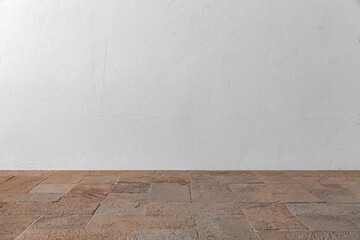 Brown rough granite surface and blank white exterior cement wall background seamless