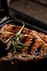 Pork meat chop grilled with delicious toasted traces and fragrant smoke. food. vertical image. top view. place for text