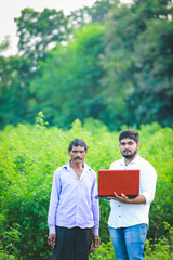 agronomist with farmer at cotton field