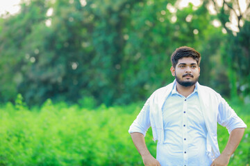 Indian happy farmer in Cotton fild, farmer holding cotton in hand