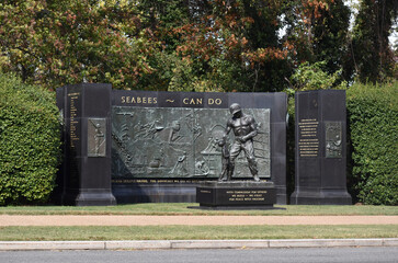 Arlington, Virginia, USA - October 25, 2021: SeaBees Memorial on Memorial Drive Near Arlington National Cemetery on a Fall Afternoon with Leaves Changing Colors in the Background