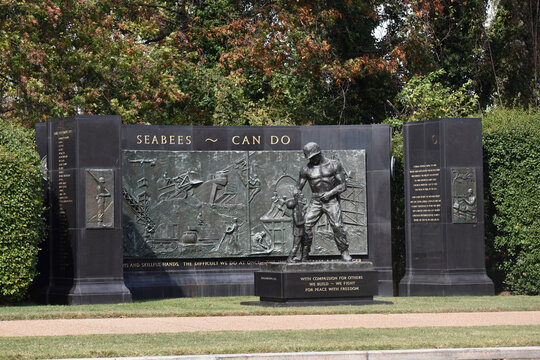 Arlington, Virginia, USA - October 25, 2021: SeaBees Memorial on Memorial Drive Near Arlington National Cemetery on a Fall Afternoon with Leaves Changing Colors in the Background
