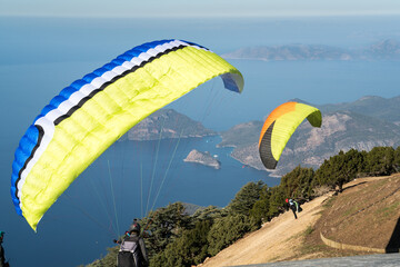 Paragliding parachuting is an extreme and fun sport. Paragliders jumping from Babadag. 21....