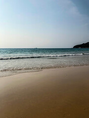beach, palm trees and Andaman sea in Thailand on Phuket island