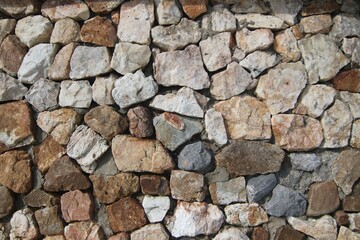 A wave-breaking wall made up of large boulders.
