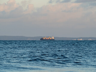 Picturesque seascape during sunset, Golden shining reflection of sunlight on the sea.