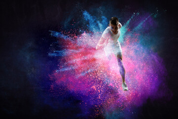 Obraz na płótnie Canvas Portrait of a fitness man running on a colourful background . Mixed media