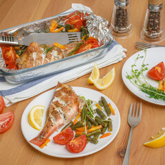 Fresh baked fish with vegetables served on plate