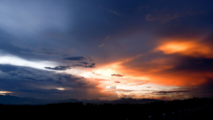 Mountain horizon and dramatic twilight sky and cloud sunset background.