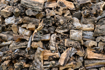 Pile of wood logs stacked for background