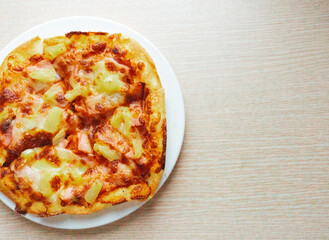 Close up of Pizza with pineapple,  mozzarella cheese, ham, bacon, pizza sauce. Sliced Hawaiian pizza texture, 