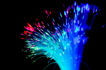 Close up of blurred light fiber optics for communication technology network