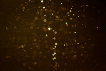 Abstract gold bokeh of water