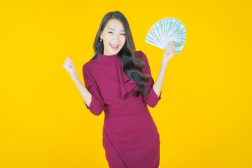Portrait beautiful young asian woman smile with a lot of cash and money