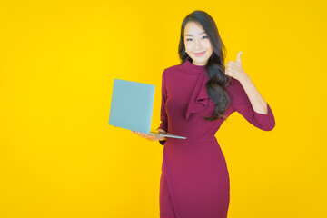 Fototapeta premium Portrait beautiful young asian woman smile with computer laptop