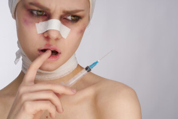 portrait of a woman woman after surgery syringe in hand injection isolated background