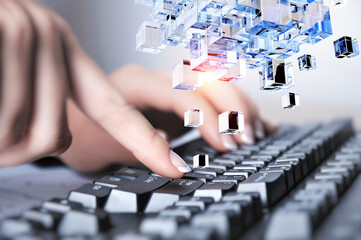 Hands of a young woman on keyboard