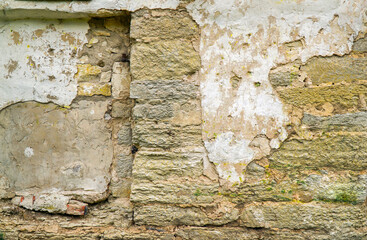 texture of the old wall of ruined stone plaster
