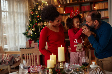 Lovely family during Christmastime at home