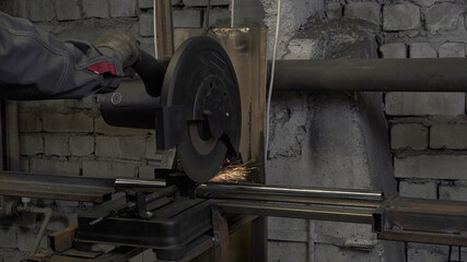 Working process on lathe with circular saw in workshop