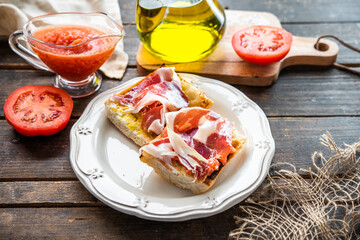 toasted bread with tomato and acorn-fed Iberian ham, typical Spanish tapa, healthy breakfast