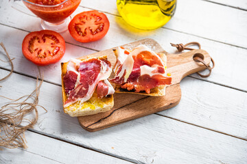 toasted bread with tomato and acorn-fed Iberian ham, typical Spanish tapa, healthy breakfast