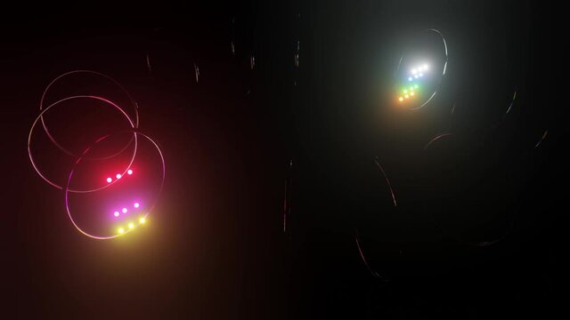 glowing multi-colored spheres fly in a circle through the rings on a black background. 3d render. loop abstract background