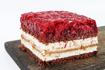 Layer cake with red raspberry jelly.