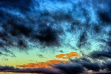 Naklejka premium Moon in the sky with clouds