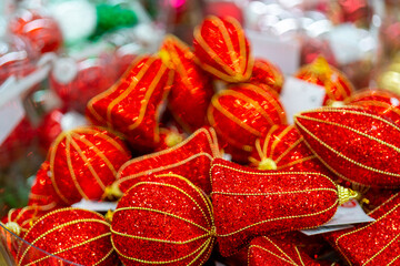 Holiday decorations for the Christmas tree. Blurred holiday background.