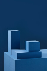 Front view of blue square podium in blue background and shadow with blank space for advertising 