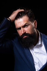 Fototapeta premium Man haircut, modern hair style. Close up portrait of male model with long hair. Healthcare and hair care concept.