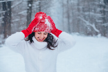 beautiful woman portrait outdoors in snowed forest