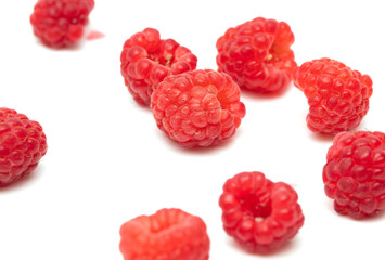 Red raspberries on a white background.