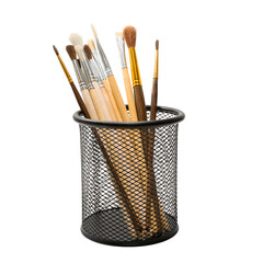 Black metal holder with different types of paint brushes isolated on white background. Stationery abstract