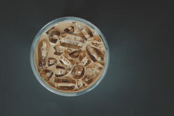 Iced coffee on black background.