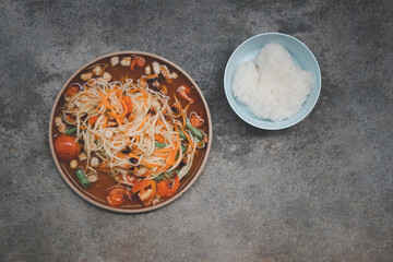 Som tam Thai or Green papaya salad with sticky rice