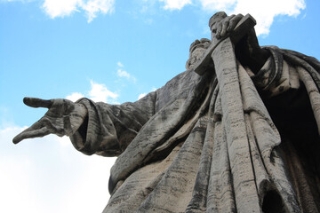 The Apostle Paul with his sword drawn in his hand. Old giant statue in front of the Basilica of...