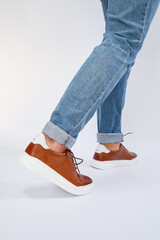 Men's casual shoes are brown with natural leather, men on the shoe in brown lace shoes