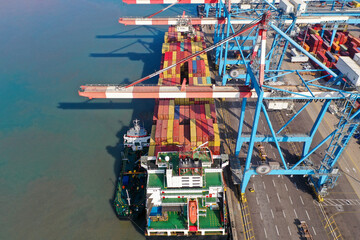 Large Container ship anchored at port.