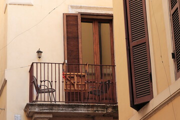 Fototapeta na wymiar Small Balcony with Chairs in Rome, Italy