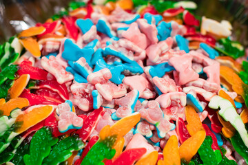 Delicious, sweet jelly-chewing colored candies in the assortment of the store. Delicious sweets.