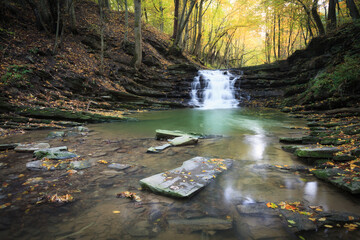 waterfall on a mountain stream in autumn - obrazy, fototapety, plakaty