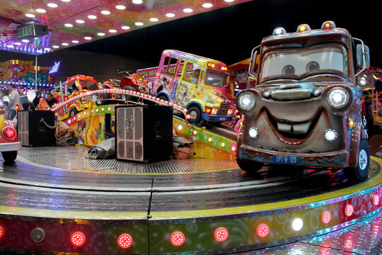 Carousel cars ride in a carnival in Portugal.