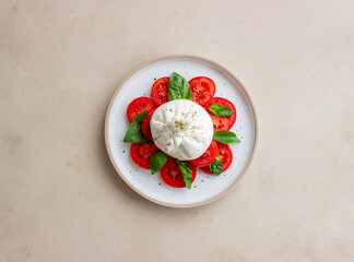 Italian burrata cheese with tomatoes and basil. Salad. Healthy eating. Vegetarian food.