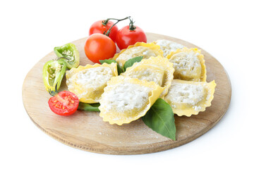 Board with raw ravioli isolated on white background